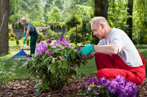 Training session for garden maintenance staff with equipment checks